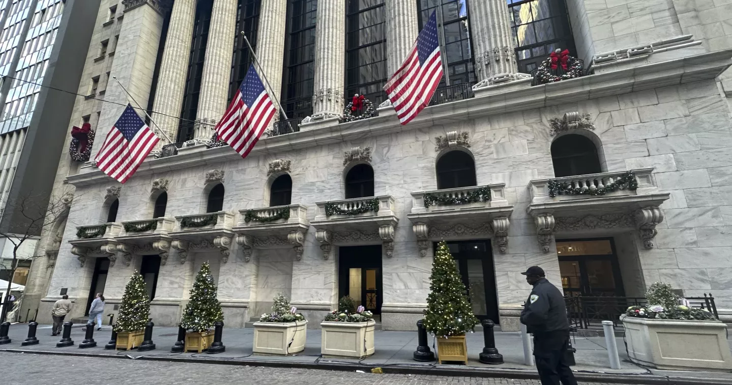 Asian markets are mixed after Wall Street edges back from its record