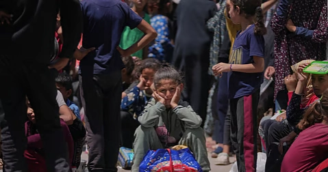 Hungry Palestinians in Gaza block and offload dozens of UN food trucks
