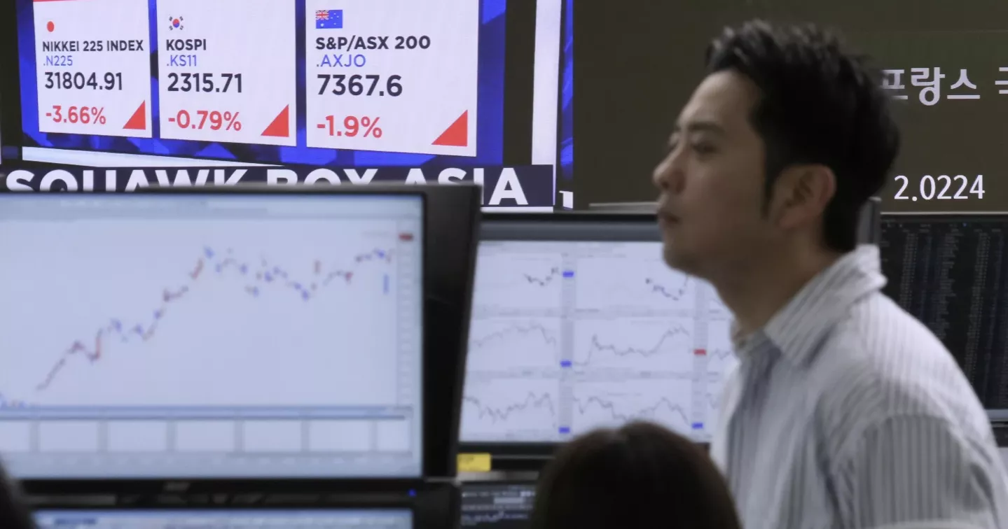 Asia shares sink as US tariffs take effect