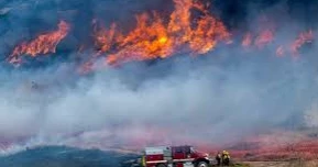 Fast-moving wildfire in windy Southern California forces evacuations