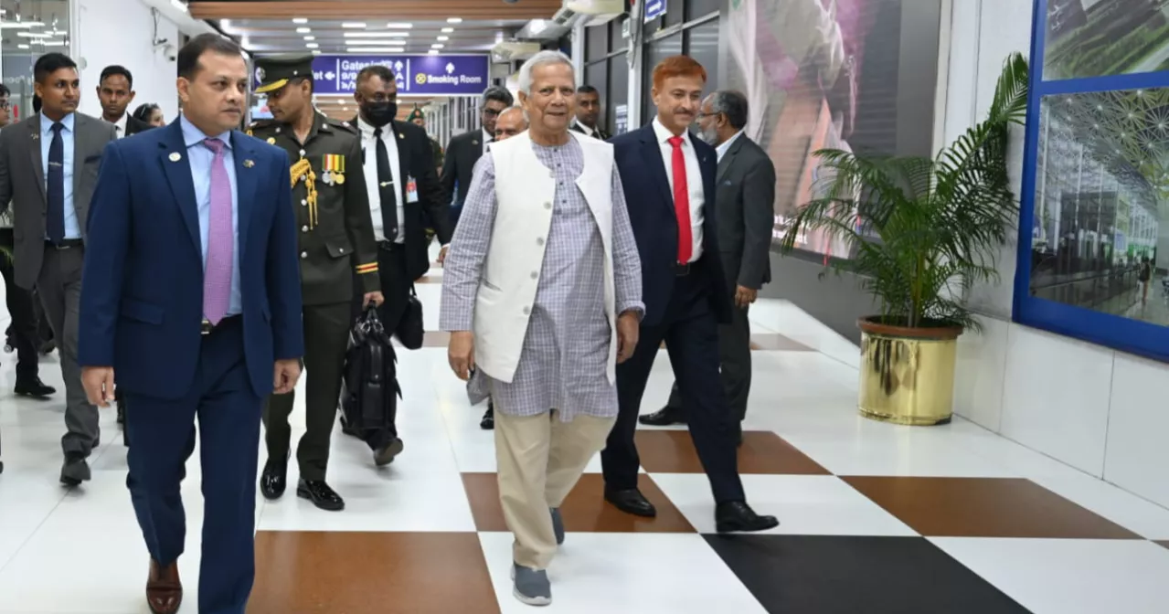Prof Yunus returns home from Malaysia