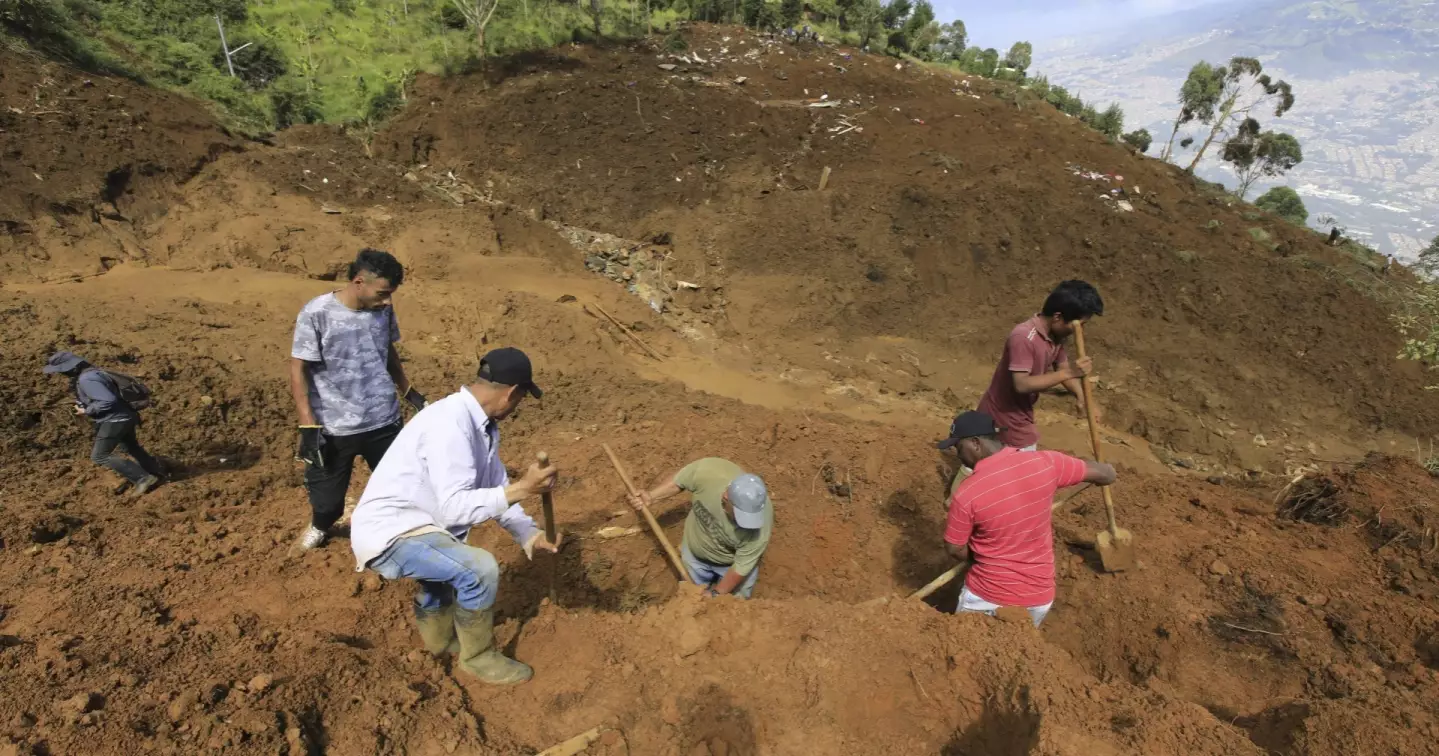 11 dead after landslide buries homes in Colombia