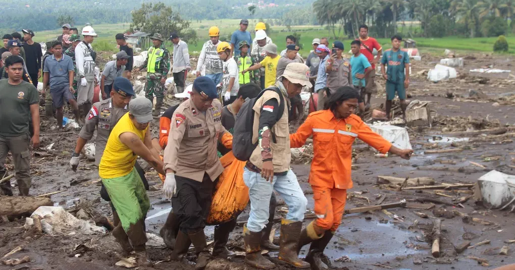 Indonesian rescuers search through rivers and rubble after flash floods that killed at least 50