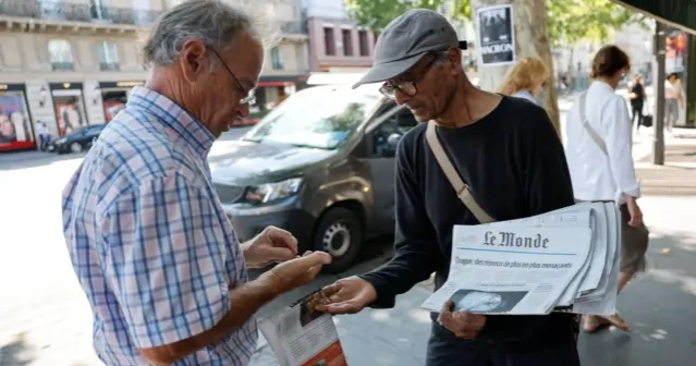 France's last newspaper hawker to receive national honour  from President Macron 