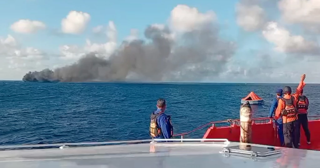 Rescue crews work to evacuate passengers from burning ferry near Bali