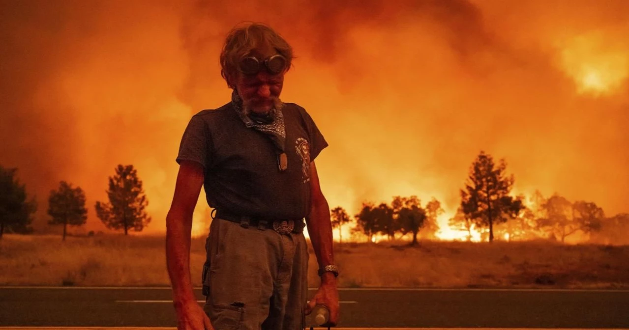 Firefighters helped by cooler weather battle blaze that has scorched area larger than Los Angeles