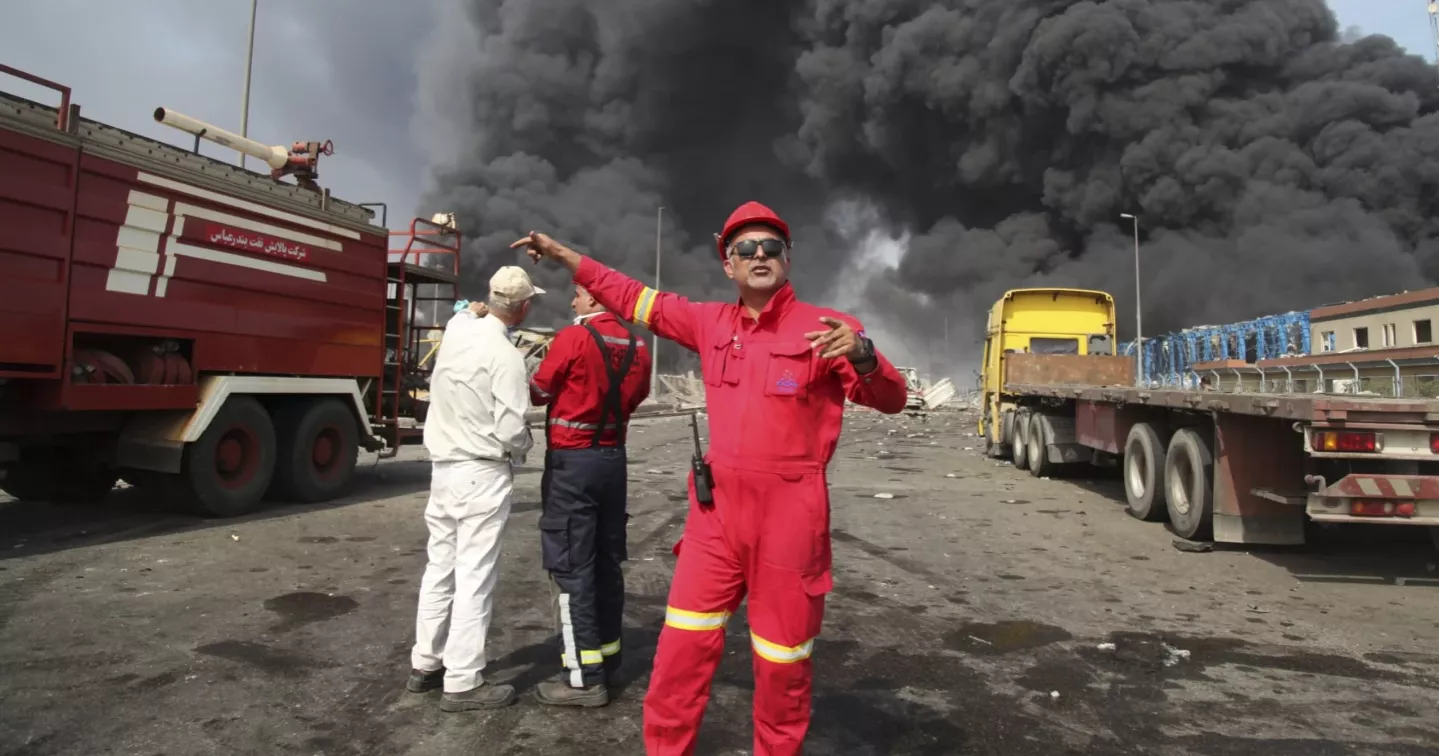 A massive explosion at an Iranian port linked to missile fuel shipment kills 14, injures some 750