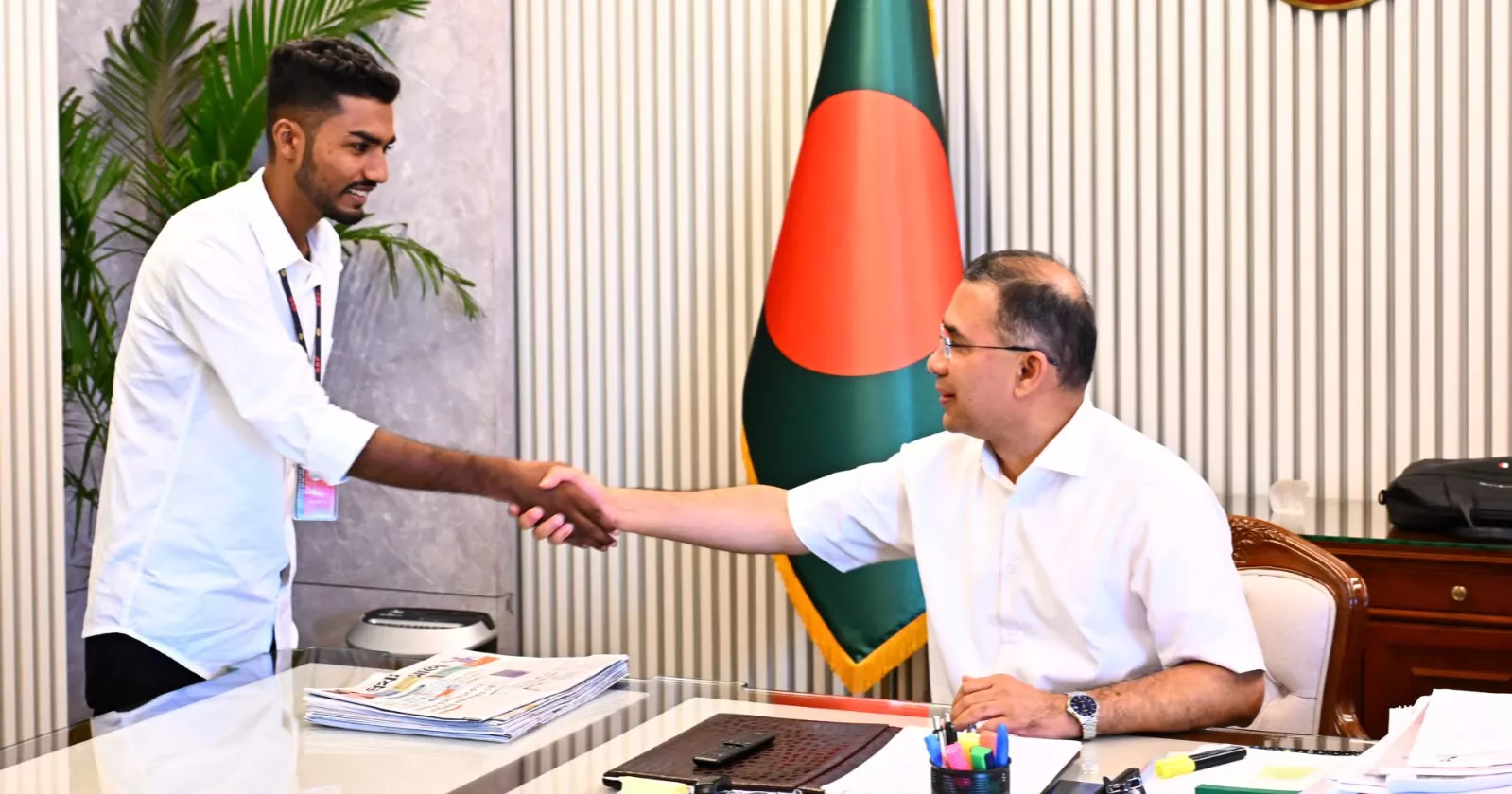 Long-held wish comes true as July uprising survivor presents blood-stained flag to PM