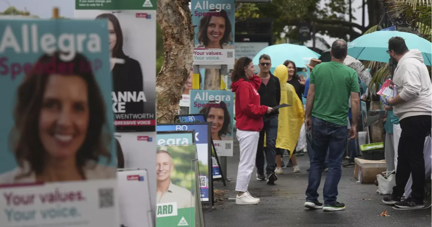 Australians start voting in general elections as pope's death overshadows campaigning