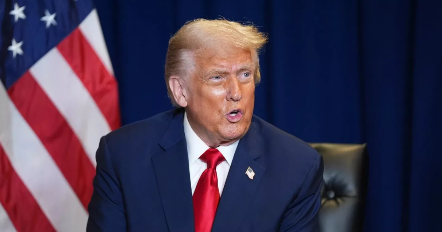 In front of drowning nations, Trump dismisses climate change as ‘con job’