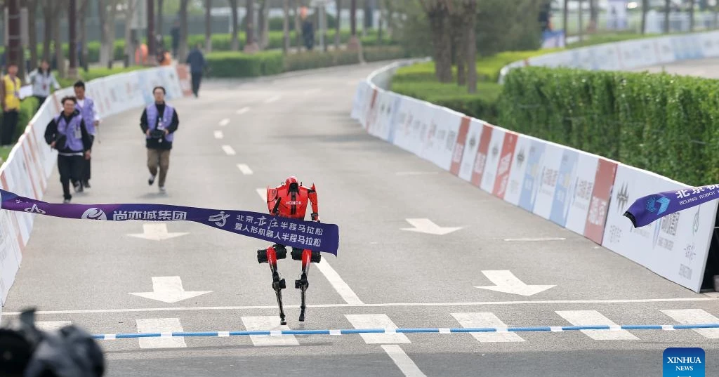 Humanoid robot beats human half-marathon record in Beijing race
