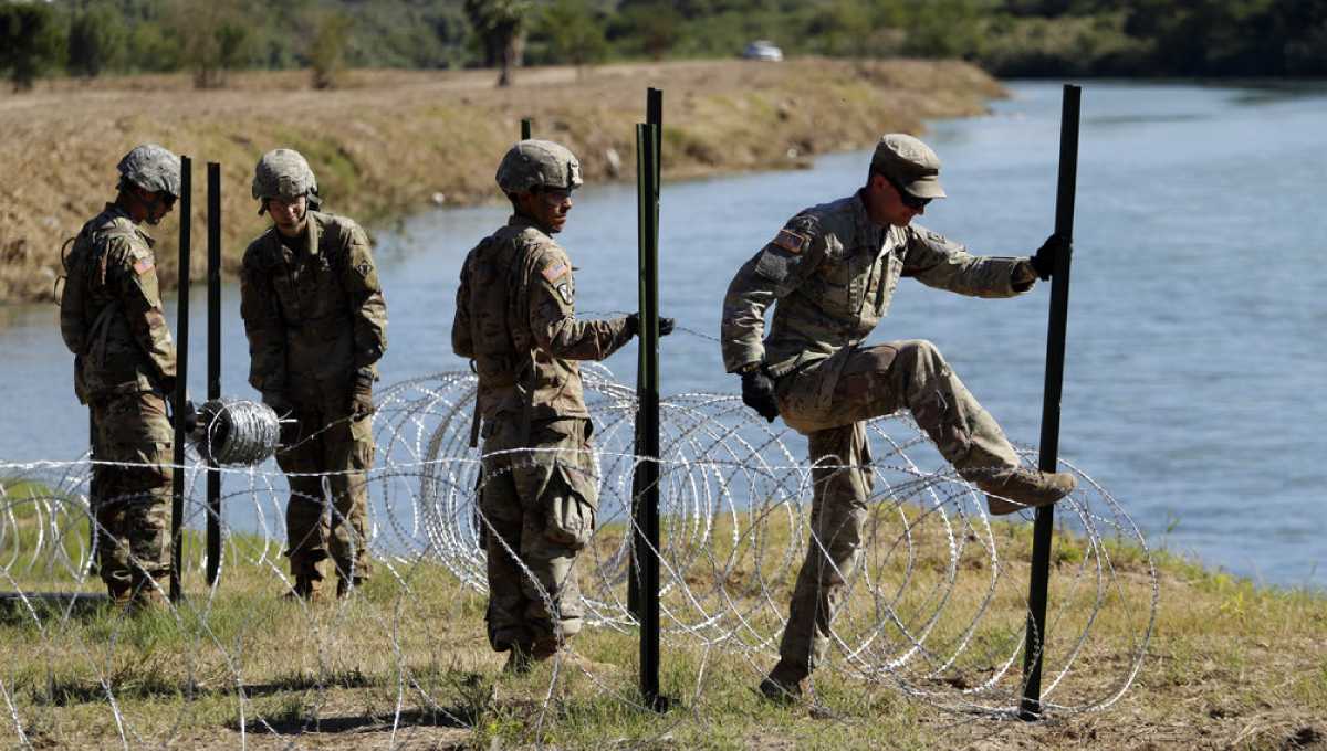 Migrants won't see armed US soldiers on border
