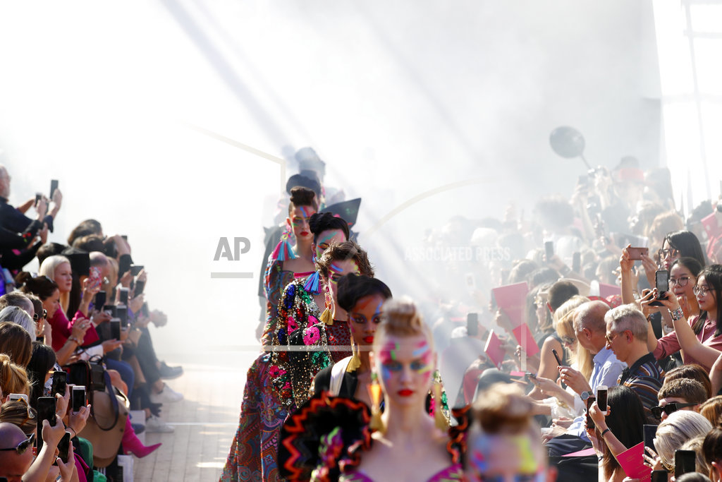 Fire, color and Gaultier's new guise hit Paris Fashion Week