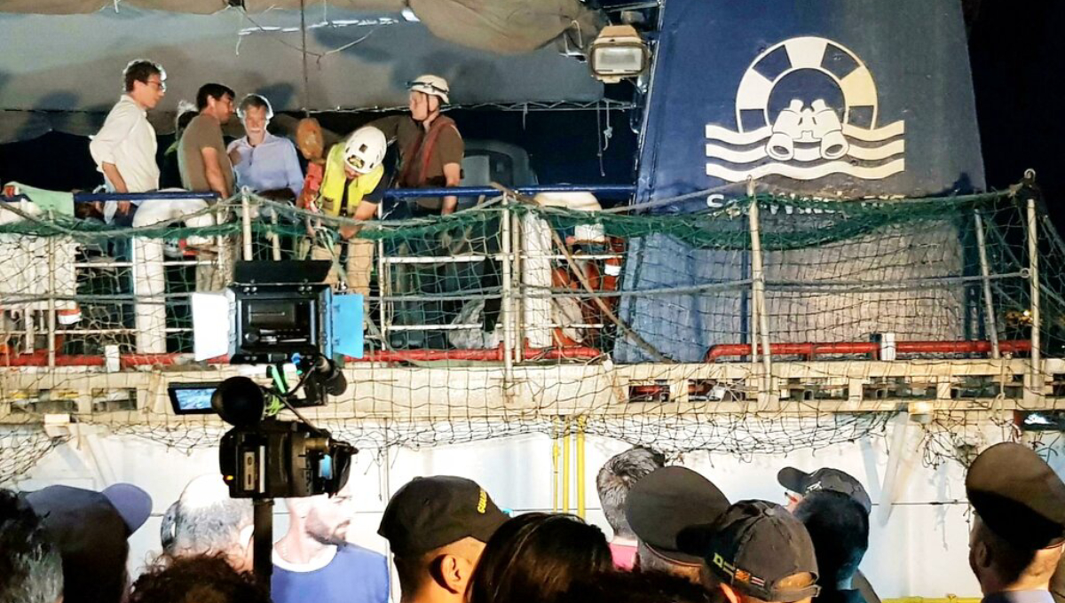 Migrant aid ship captain detained; Italy police boat rammed