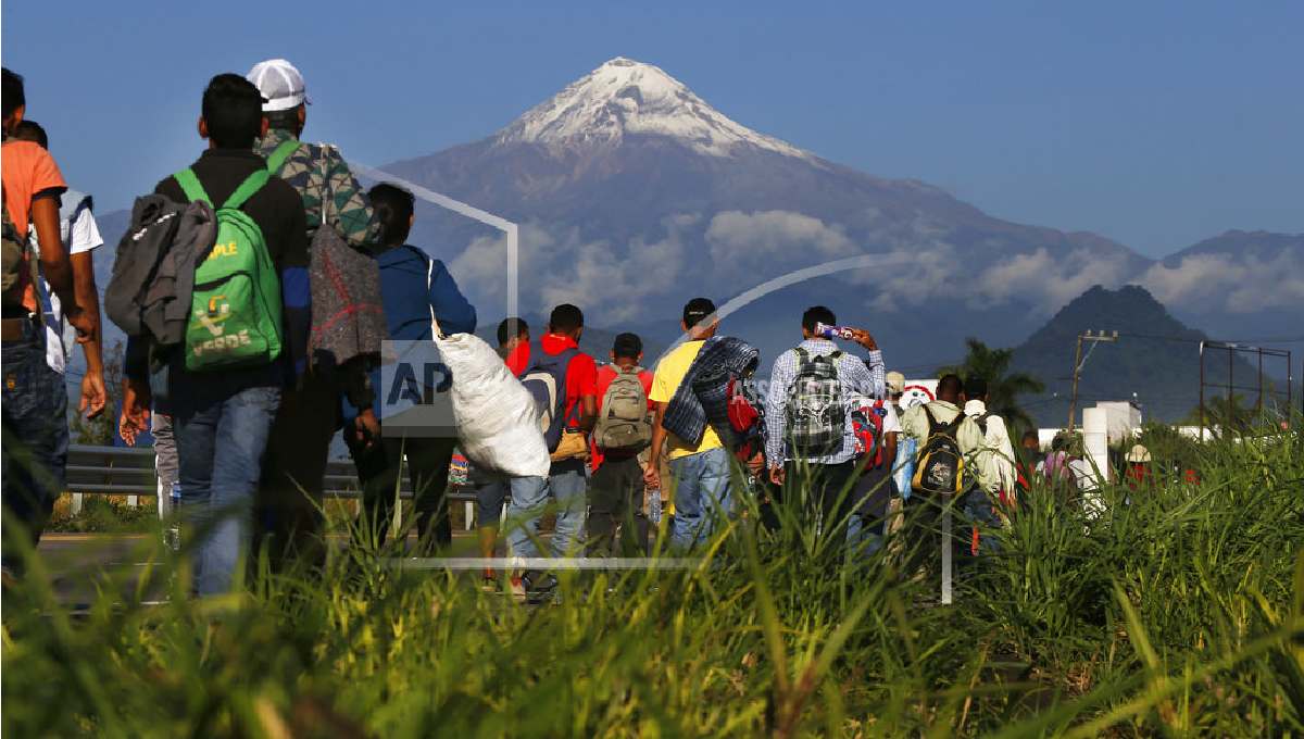 Caravan migrants arrive in Mexico City, bed down in stadium