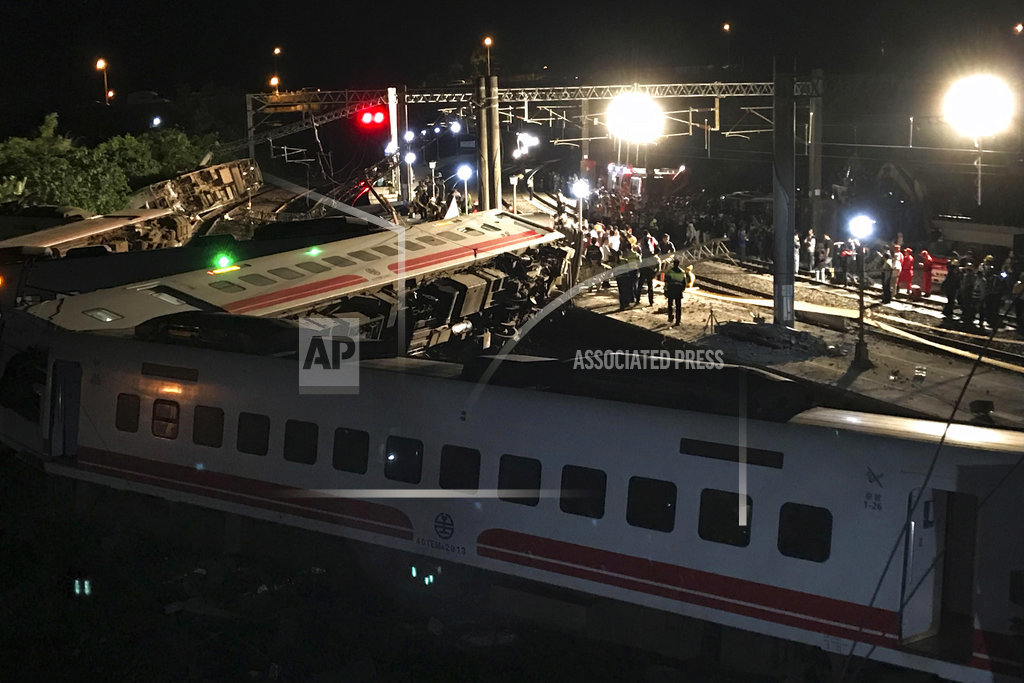 Rescuers search site after train crash killed 18 in Taiwan