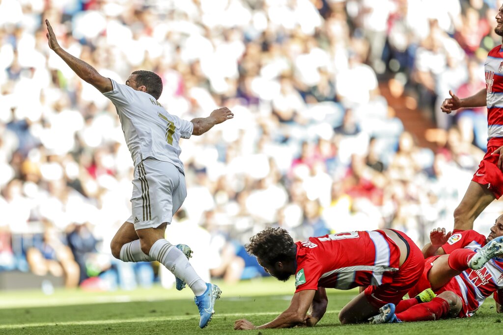 Hazard scores 1st league goal as Madrid beats Granada 4-2
