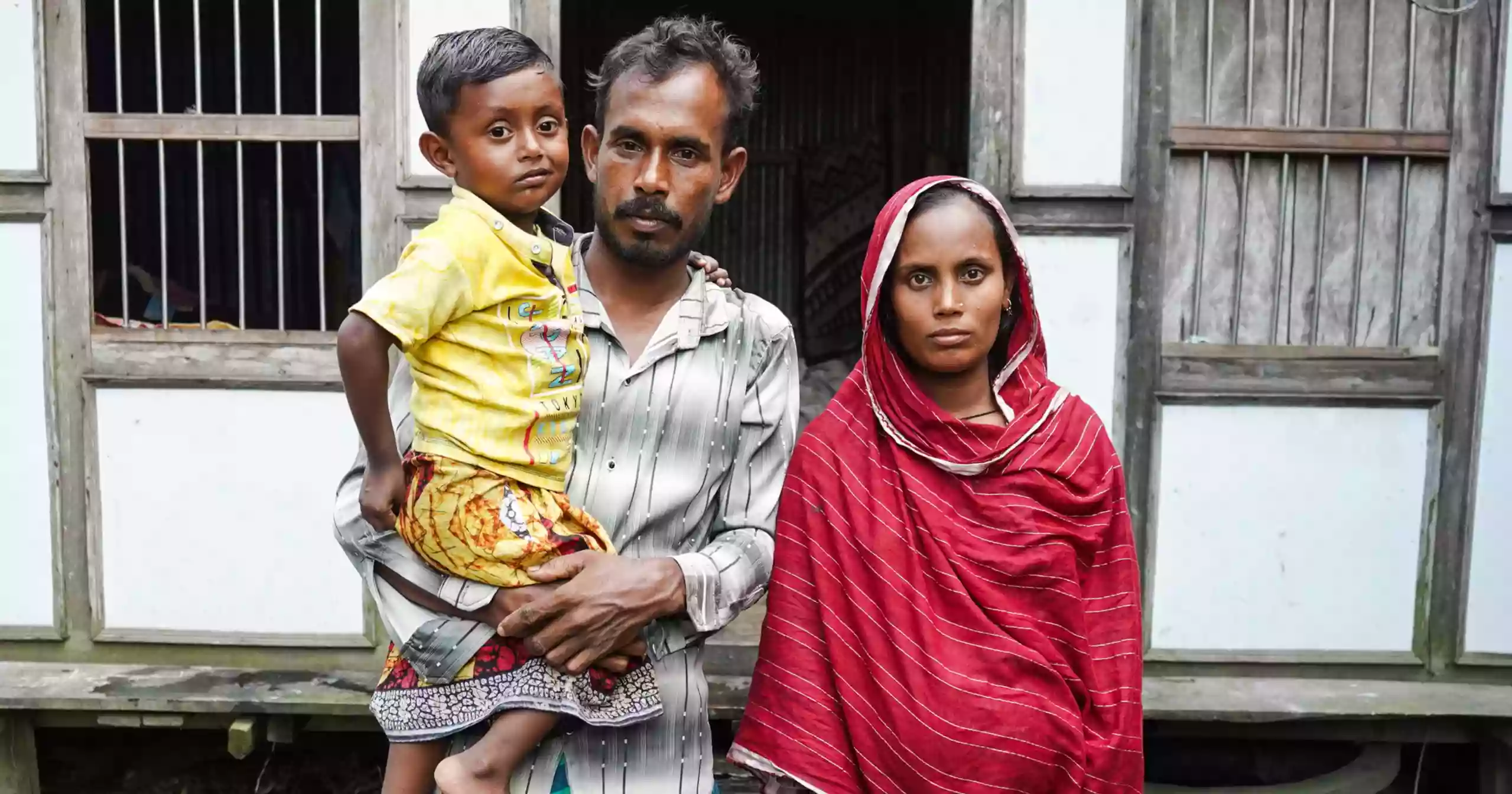 As rivers swallow villages, one wooden house keeps hope afloat