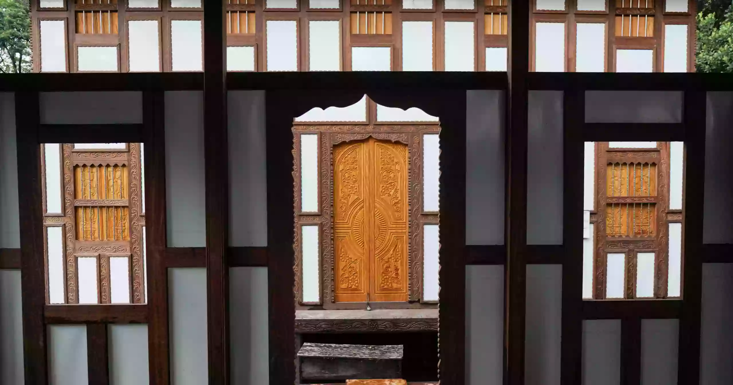 As rivers swallow villages, one wooden house keeps hope afloat