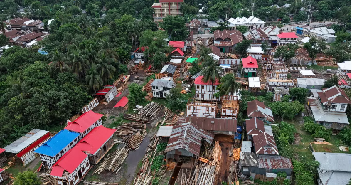 As rivers swallow villages, one wooden house keeps hope afloat