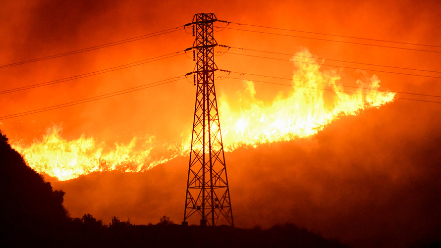 Los Angeles fire began under power lines, cause not known
