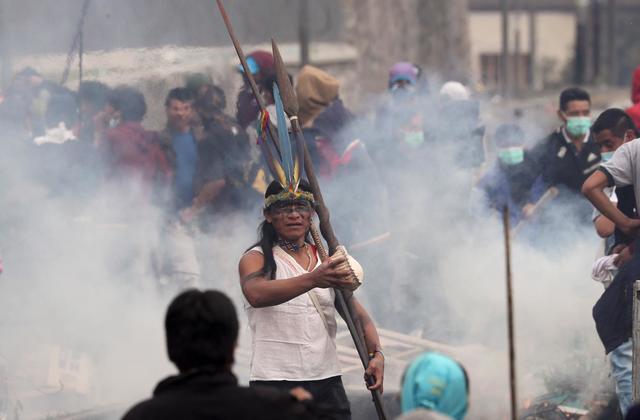 Ecuador clash site has party clowns, recycling, tear gas