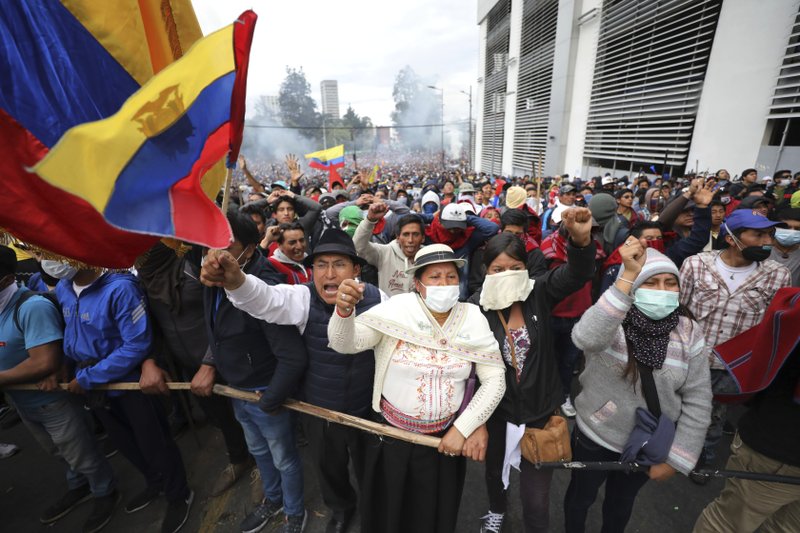 Protesters move into Ecuador's capital; president moves out