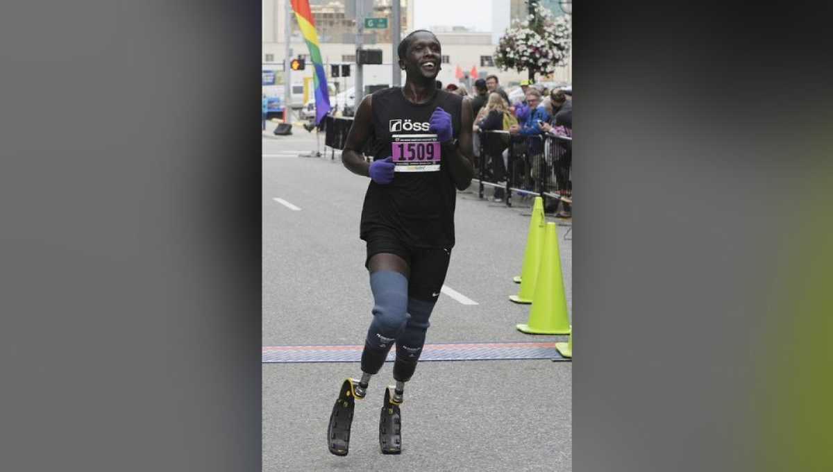 Runner who lost feet to frostbite completes first marathon